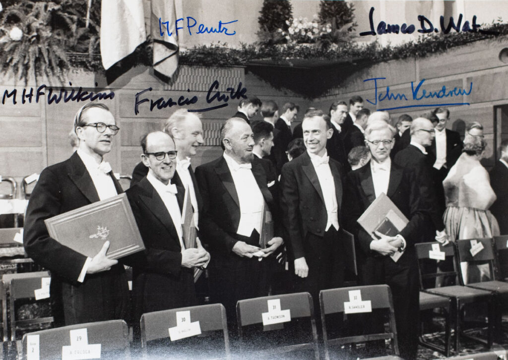 1962 Nobel Prize-Winning Scientists Signed Photograph. [James D. Watson, Francis Crick and Maurice Wilkins Signed Photograph].