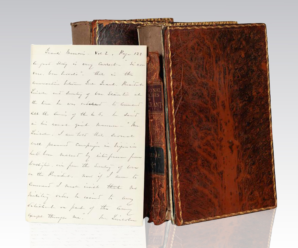 Old leather-bound books with handwritten letter.