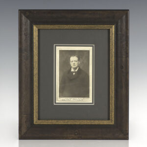 Black and White Rotary Photograph of Winston Churchill, while he was the Under-Secretary of State for the Colonies; signed by him