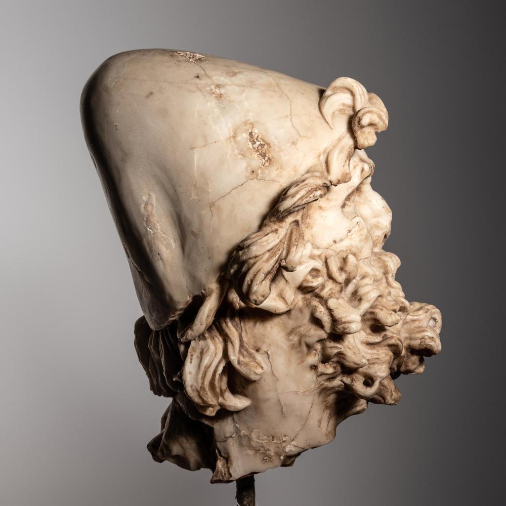 Side view of an ancient marble head sculpture