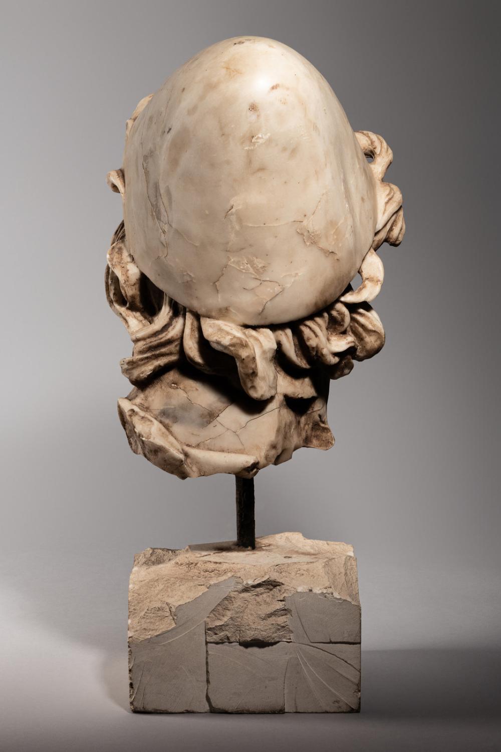 Rear view of an ancient marble head sculpture