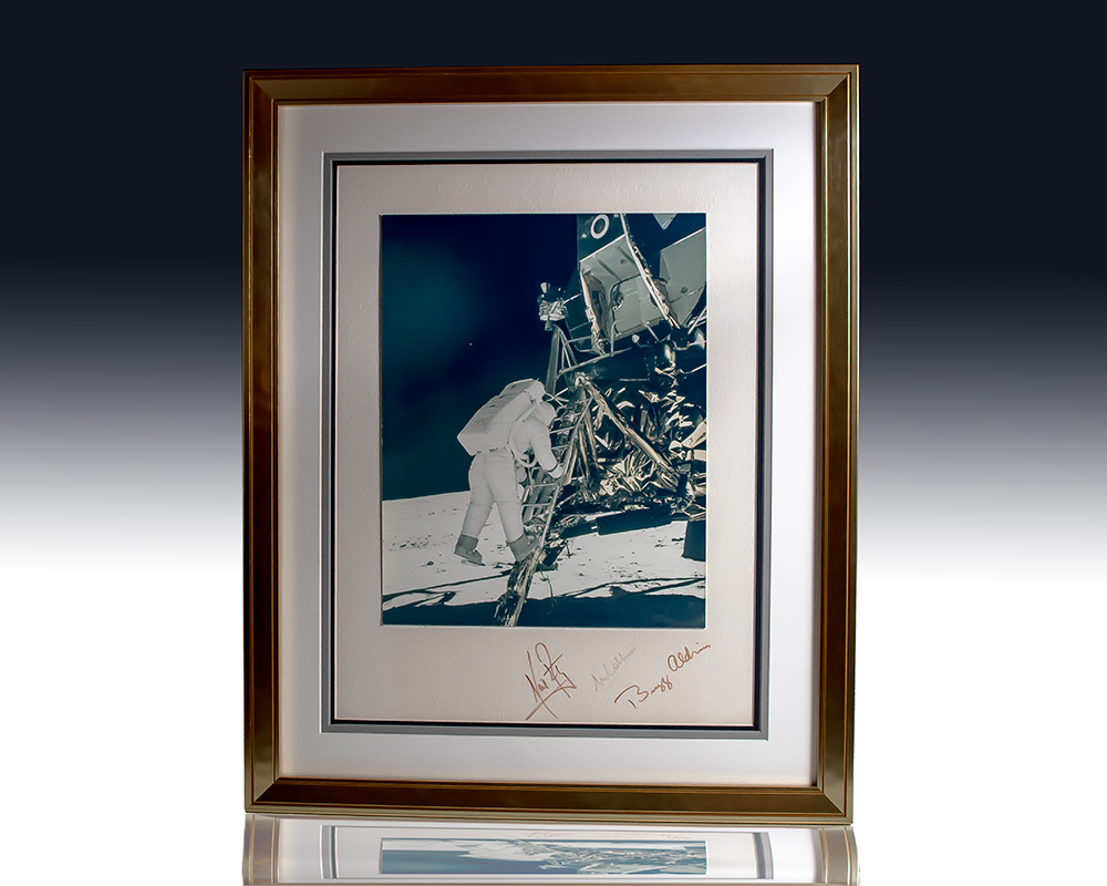 Neil Armstrong, Buzz Aldrin, and Michael Collins Signed Photograph of Descent Onto Lunar Surface.