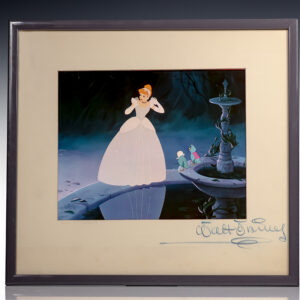 Cinderella standing by a fountain with two small birds