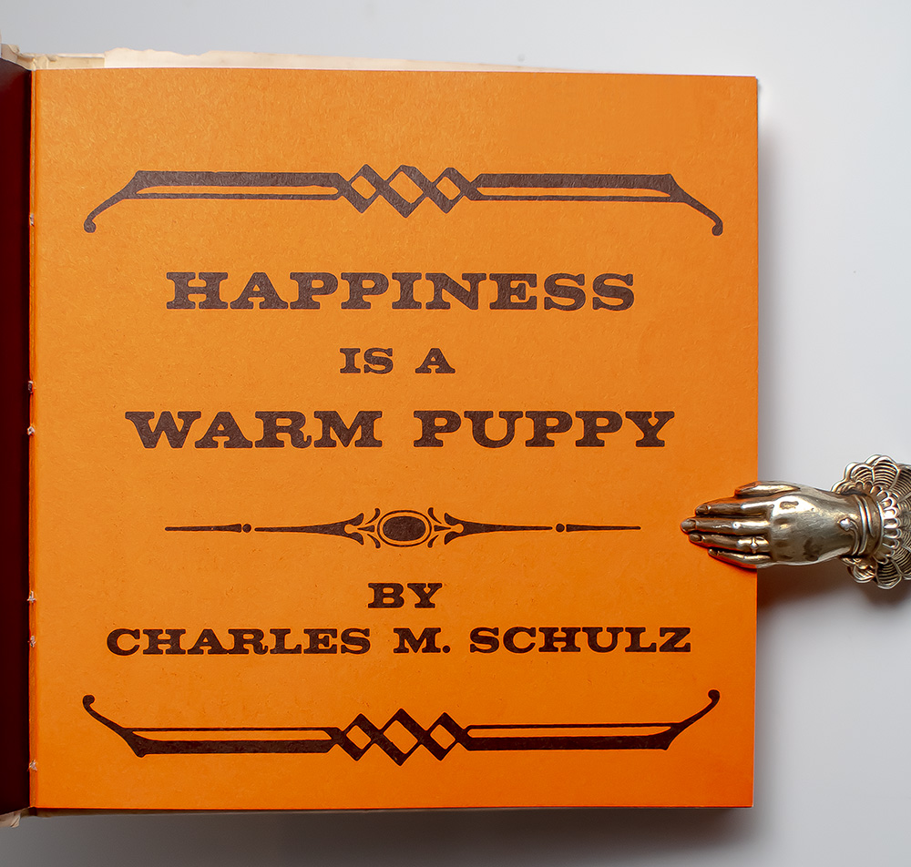 Happiness is a Warm Puppy.