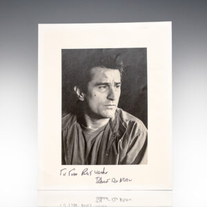 Man looking to the side with a handwritten signature
