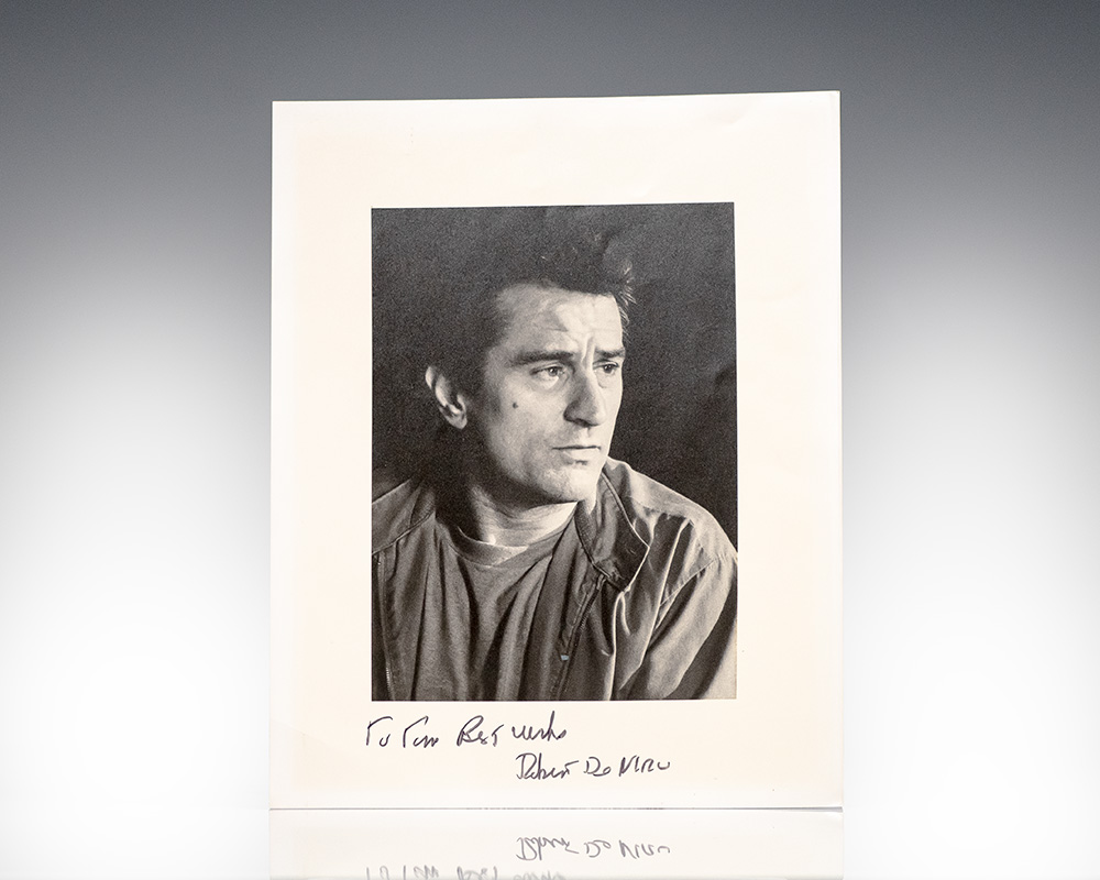 Man looking to the side with a handwritten signature