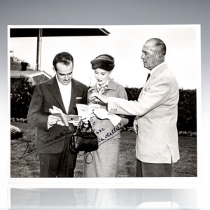 Black and white photo of three people outdoors