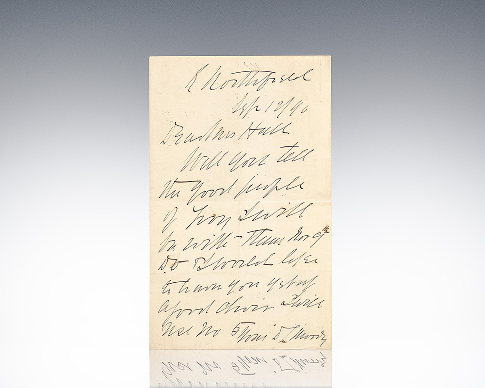 Handwritten letter on aged paper featuring elegant cursive writing