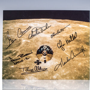 Photo of Apollo spacecraft orbiting the Moon signed by astronauts