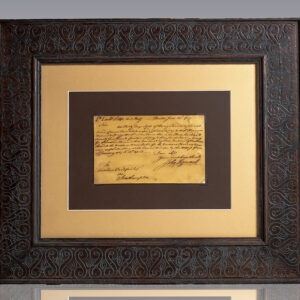 Framed handwritten historical letter displayed