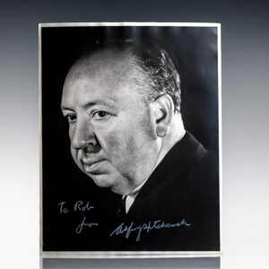 Black-and-white portrait photograph of a man in a suit