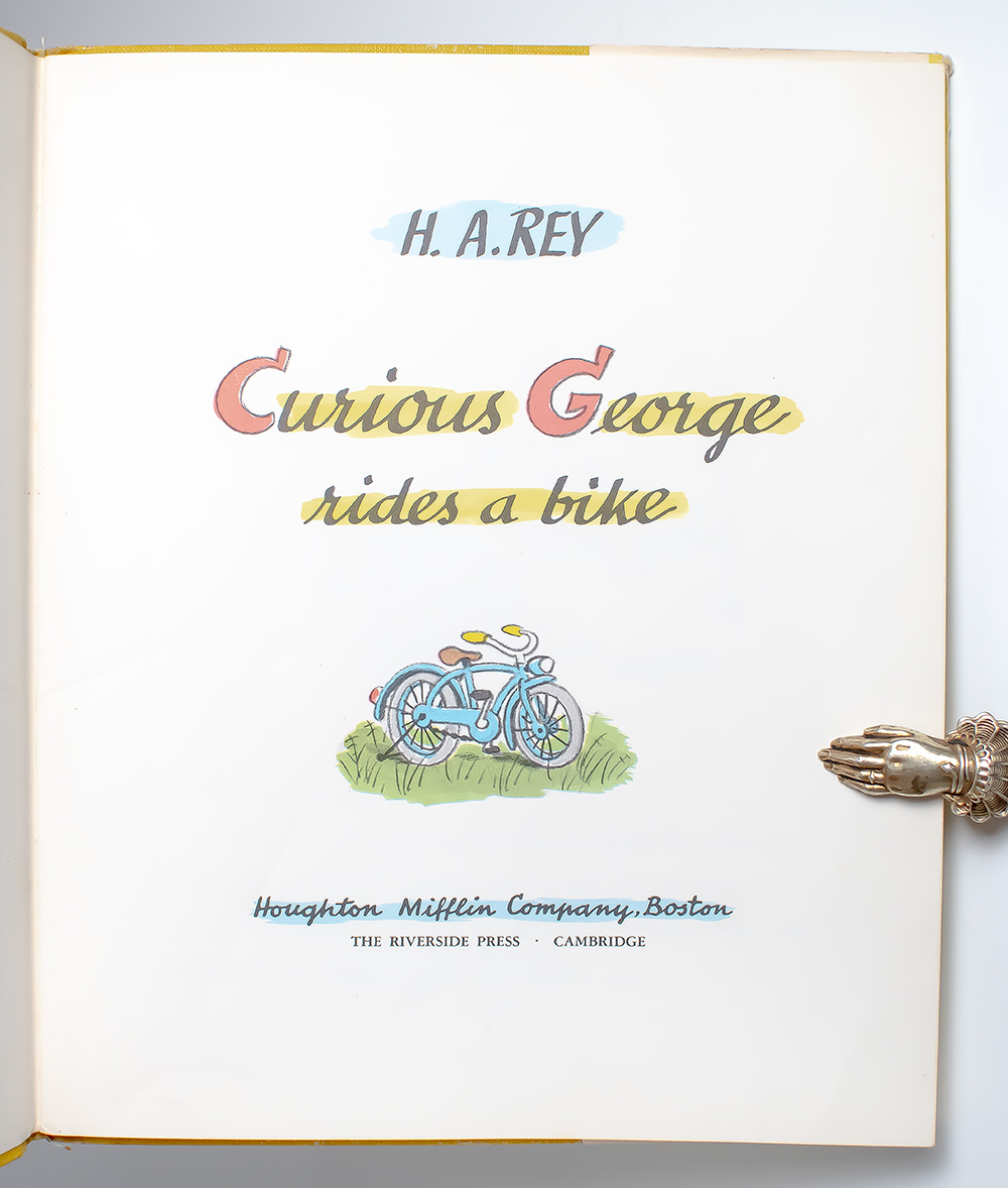 Curious George Rides a Bike.