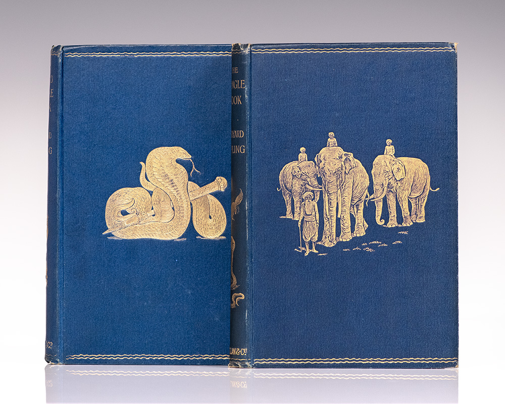 Two blue antique books with gold embossed snake and elephant designs