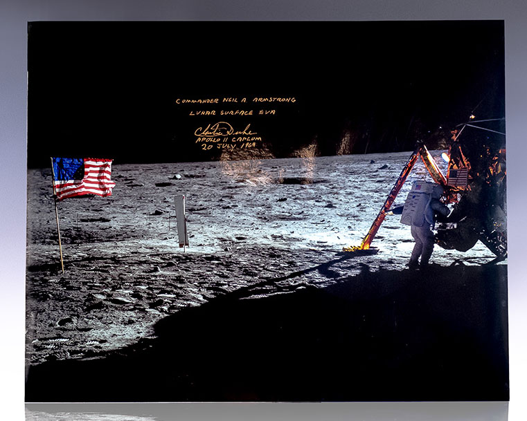 Large photograph of Neil Armstrong on the moon during the Apollo 11 mission; signed by Capsule Communicator Charlie Duke