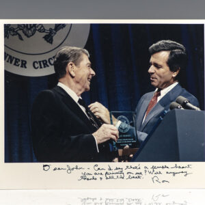 Rare photograph of Ronald Reagan receiving a Life Member Awards from the Republican Senatorial Inner Circle; inscribed by him