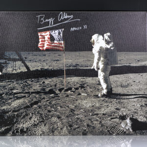 Iconic photograph on canvas of Buzz Aldrin standing next to the United States flag planted atop the lunar surface during the Apollo 11 mission. Boldly signed “Buzz Aldrin Apollo XI”Iconic photograph on canvas of Buzz Aldrin standing next to the United States flag planted atop the lunar surface during the Apollo 11 mission. Boldly signed “Buzz Aldrin Apollo XI.”