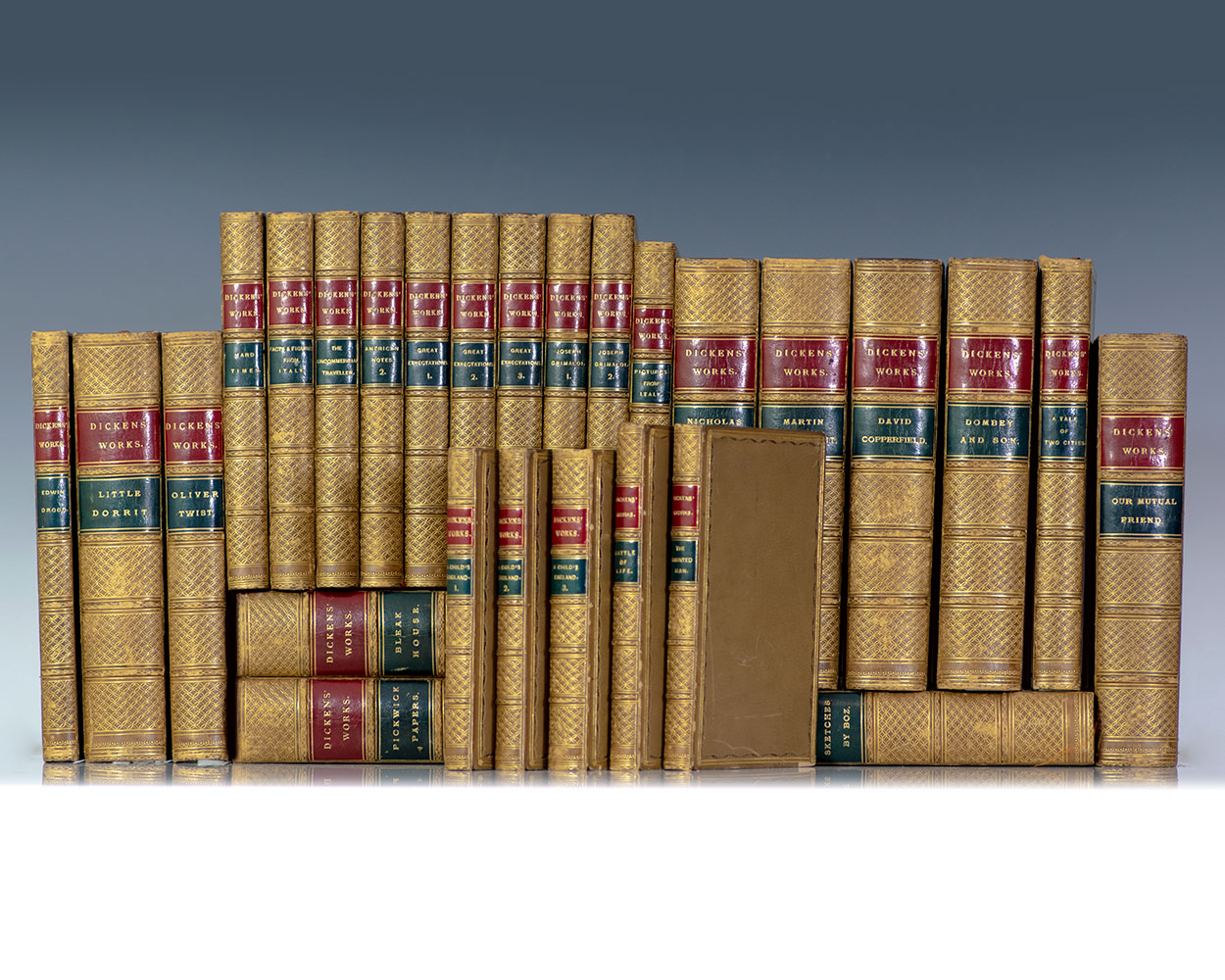 The Works of Charles Dickens; elaborately bound and containing 23 first editions of his novels in book form