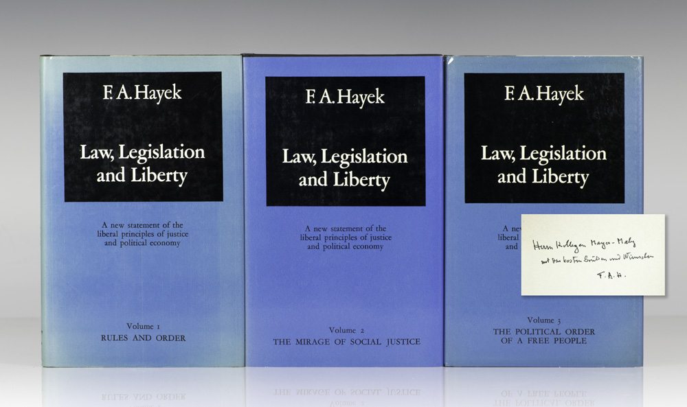 First editions of Law, Legislation and Liberty; volume I inscribed by Hayek