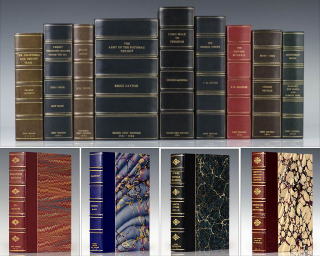 Books bound by Harcourt Bindery with gold details and marbled paper. 