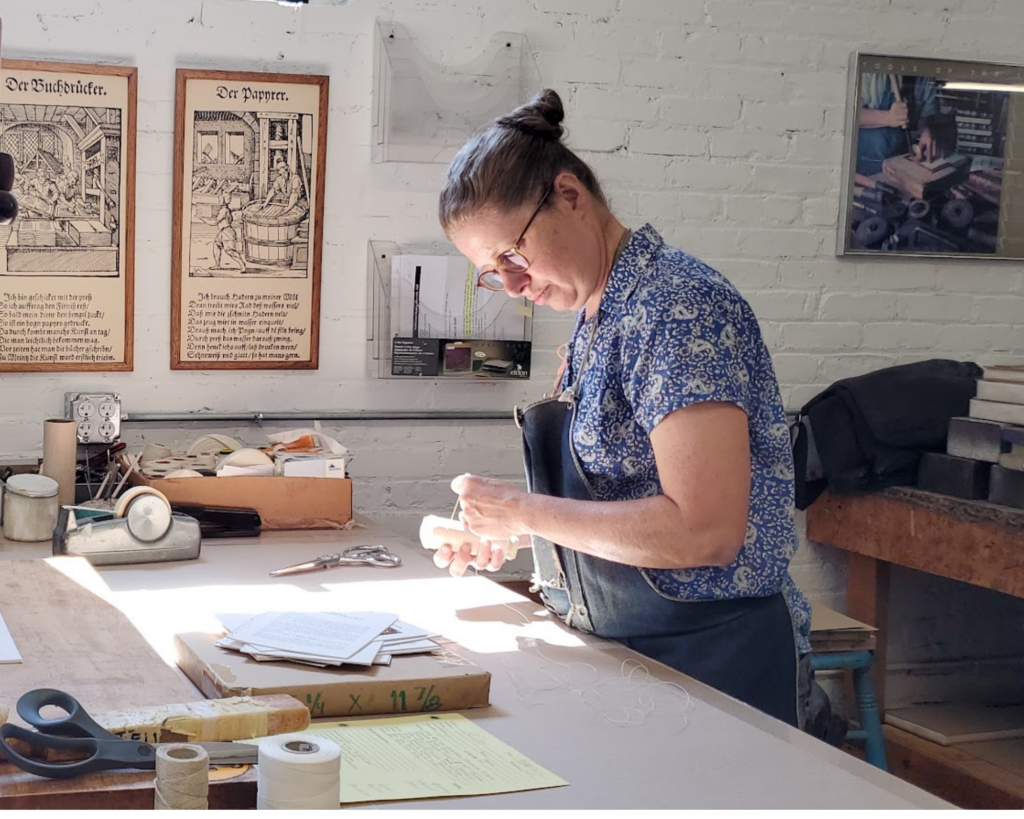 Woman working at Harcourt Bindery 