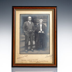 Framed black-and-white photograph of two men standing side by side