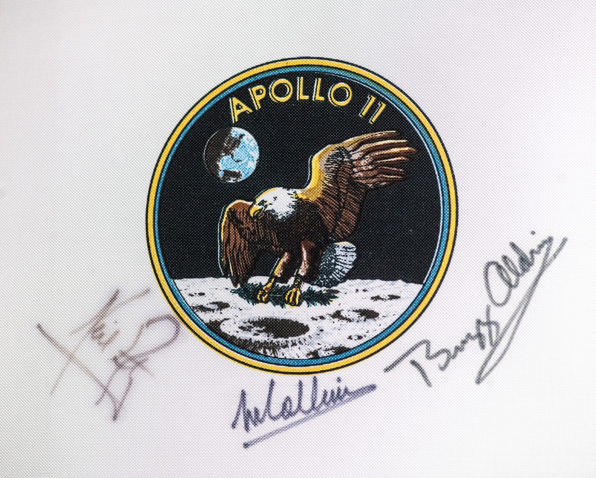Neil Armstrong, Buzz Aldrin and Michael Collins Signed Apollo 11 Beta Cloth Swatch.