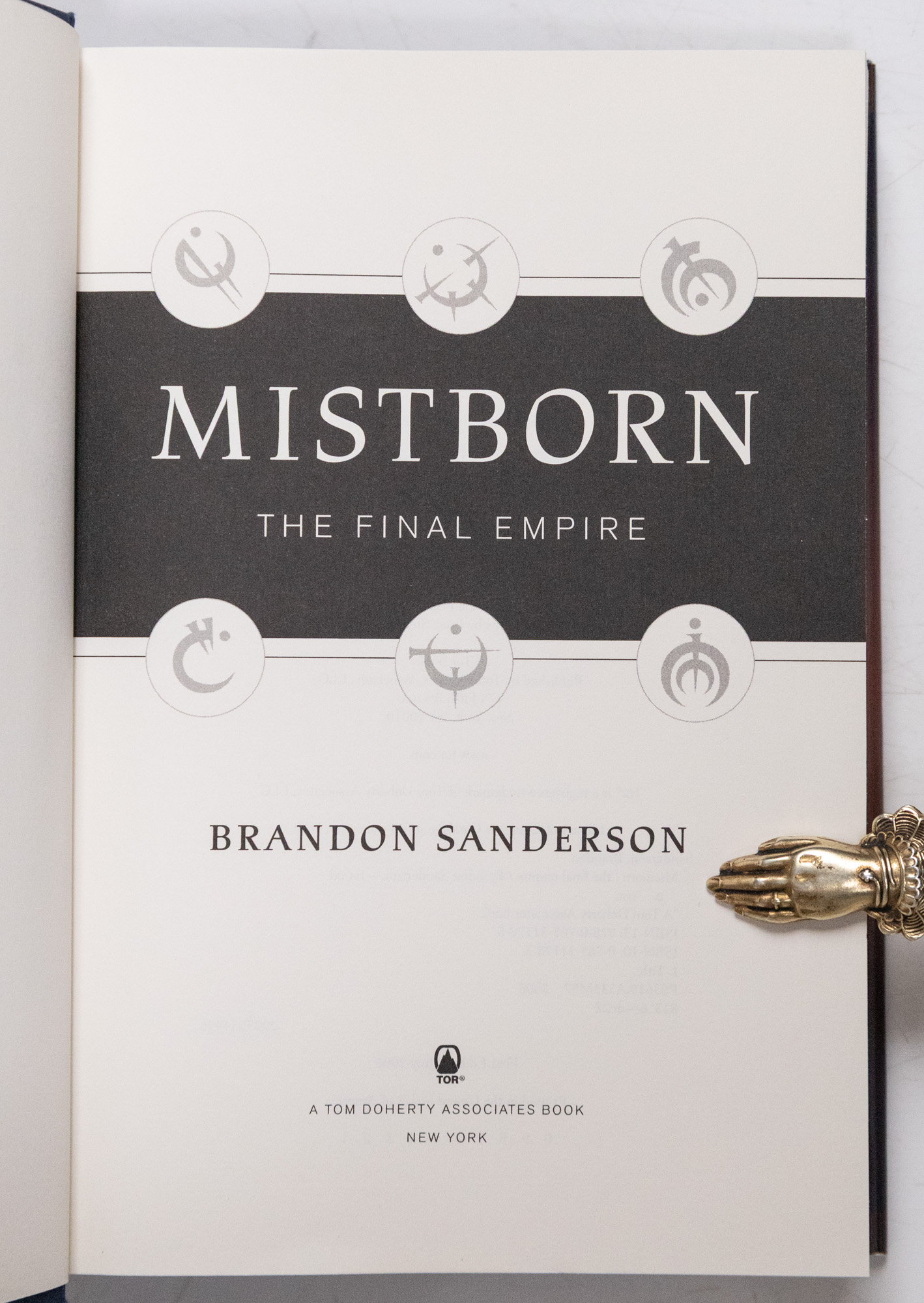 Mistborn Trilogy: The Final Empire, The Well of Ascension, and The Hero of Ages.